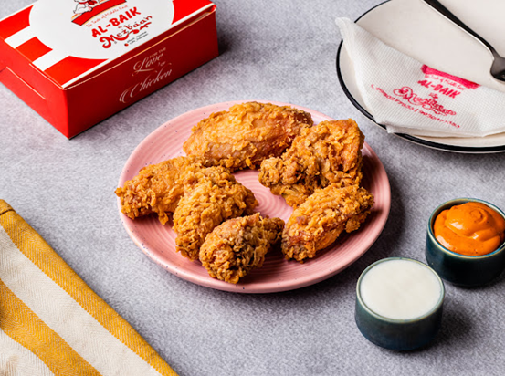 Crispy Al Rayyan fried chicken with fresh ingredients